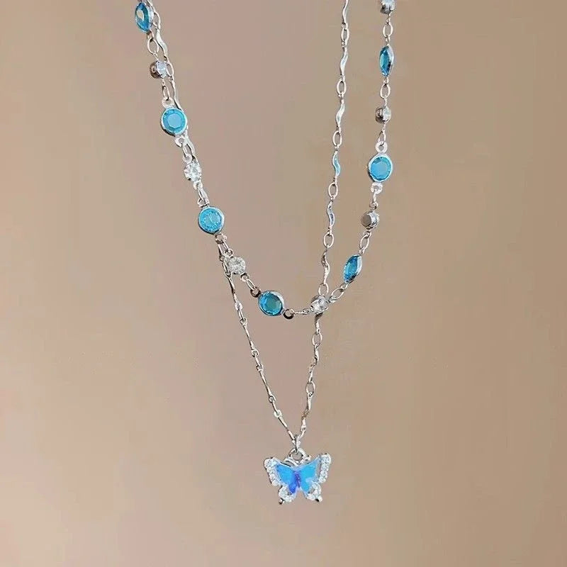Blue Crystal Butterfly Necklace - Kouttor Soliman