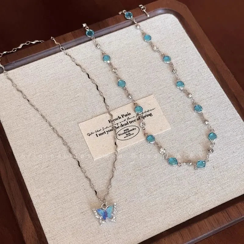 Blue Crystal Butterfly Necklace - Kouttor Soliman